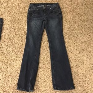 Blue jeans with gem designs.